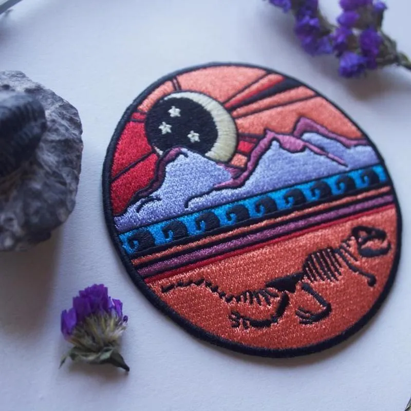 Dinosaur Skeleton Mountain Iron On Patch