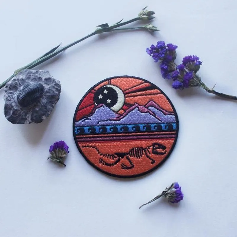 Dinosaur Skeleton Mountain Iron On Patch