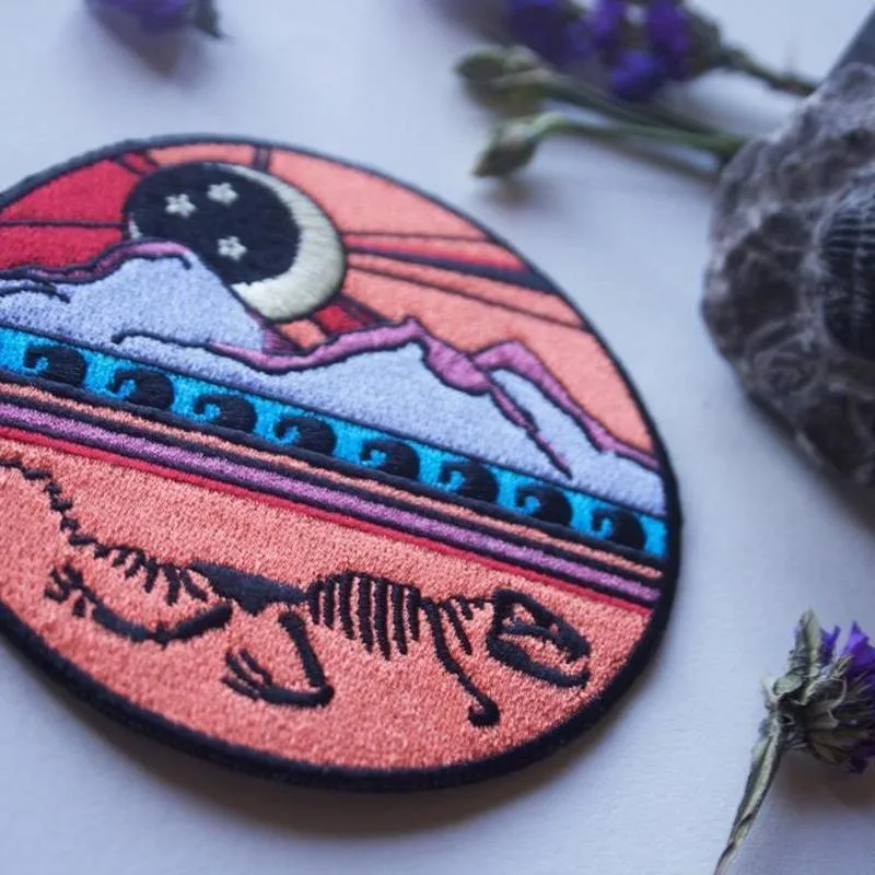 Dinosaur Skeleton Mountain Iron On Patch